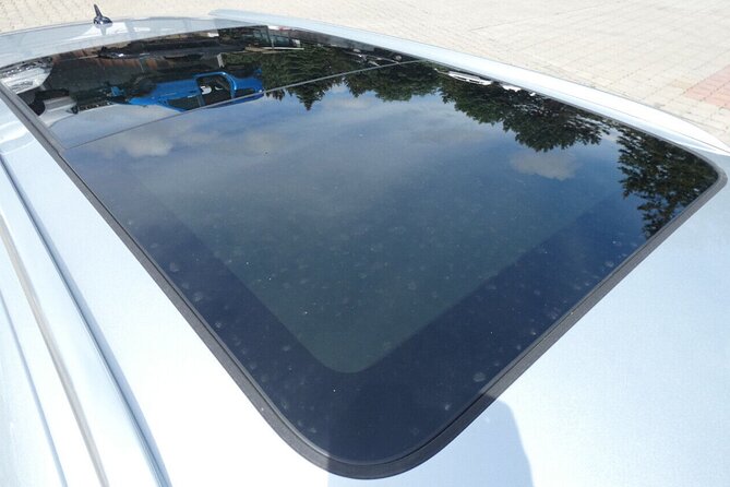 Private Airport and City Transfer in Panoramic Roof Station Wagon - A panoramic-roof wagon turns a transfer into part of the trip