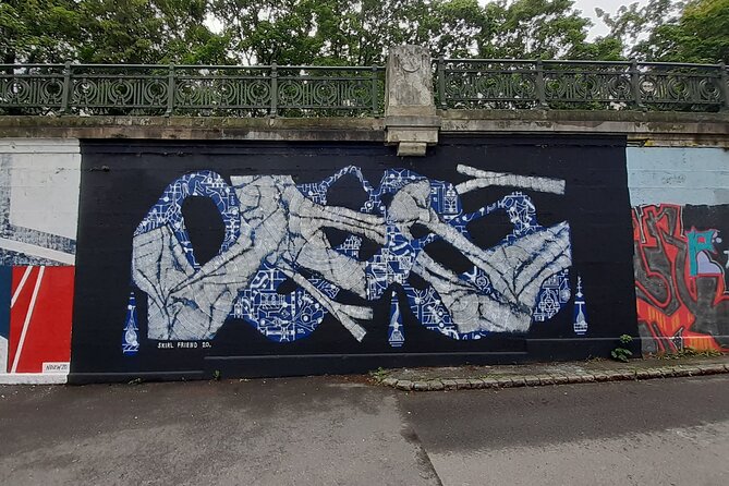 Street Art Tour in Vienna - Friedensbrücke: TS90 crew pieces and Manuel Muriel’s octopus (and why overpainting is part of the point)